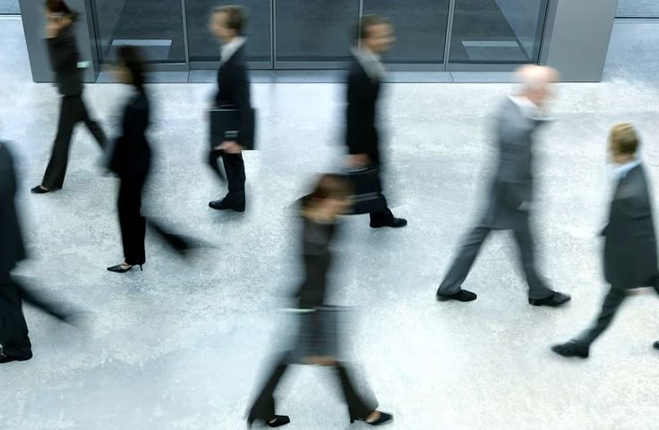 Professionals moving through a financial workplace
